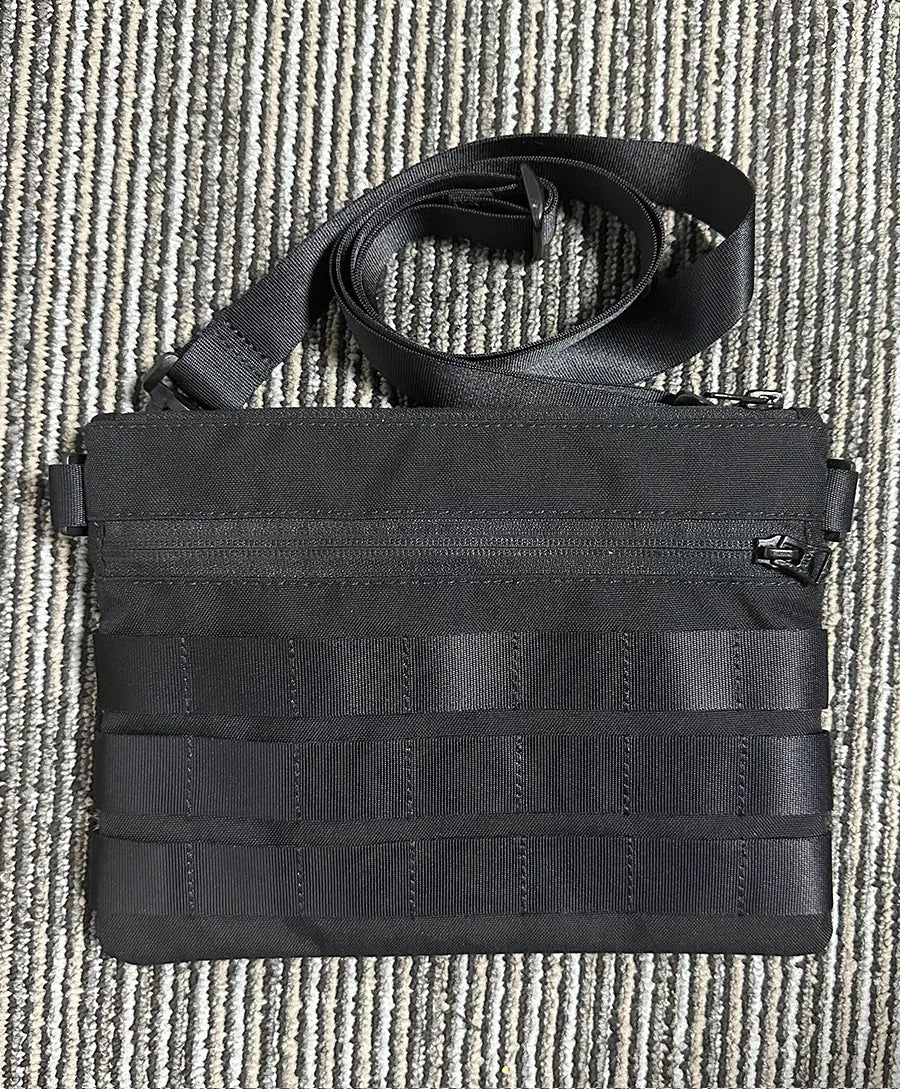 Solid black Oxford cloth portable organiser bag measuring 18cm by 3.5cm.