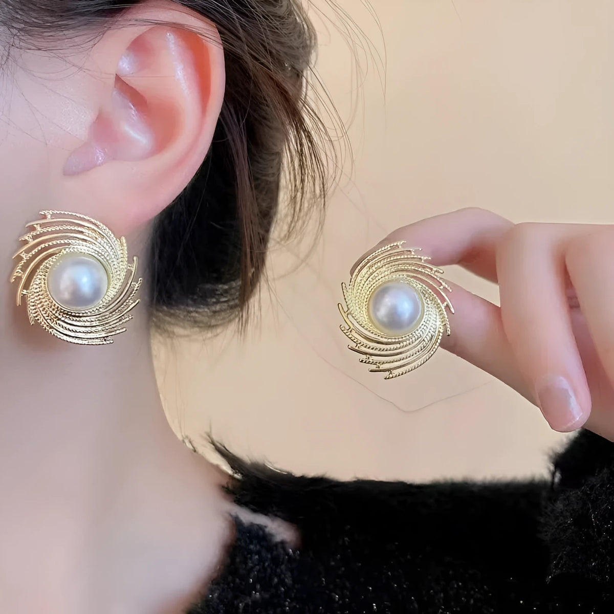 A pair of vintage-inspired pearl-coloured floral drop earrings with an irregular design on a white background.