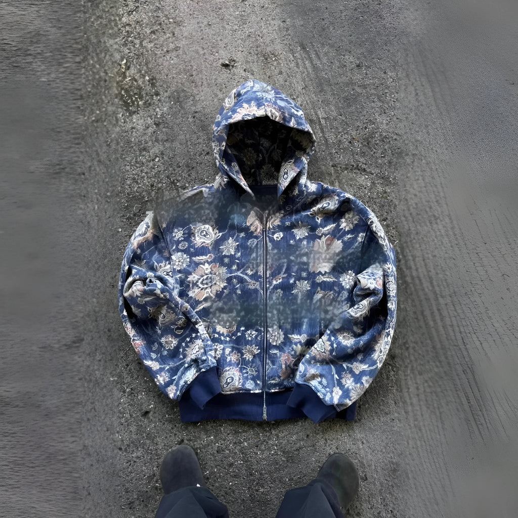 Men's blue loose hooded zip coat with long sleeves on a hanger