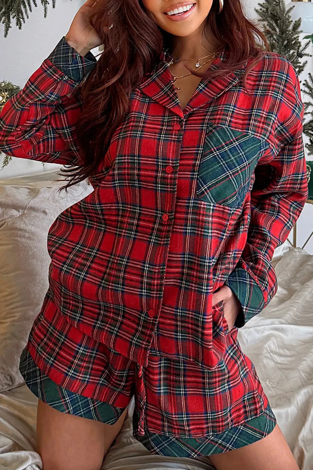 Red plaid Christmas pajama set with long sleeve shirt and shorts featuring contrast patches