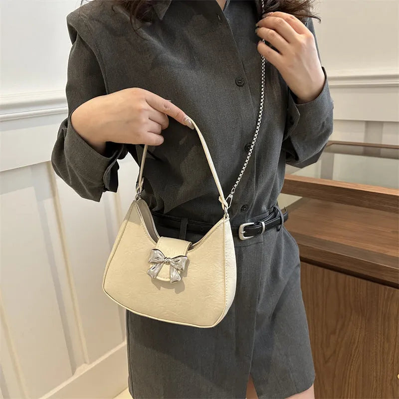 PU dumpling underarm bag with one-shoulder strap, sandwich pocket, sewing thread detail, shown in black