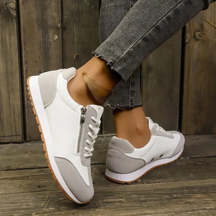 Women's flat-heeled shoes in grey, white, and champagne with rubber sole and PU upper.