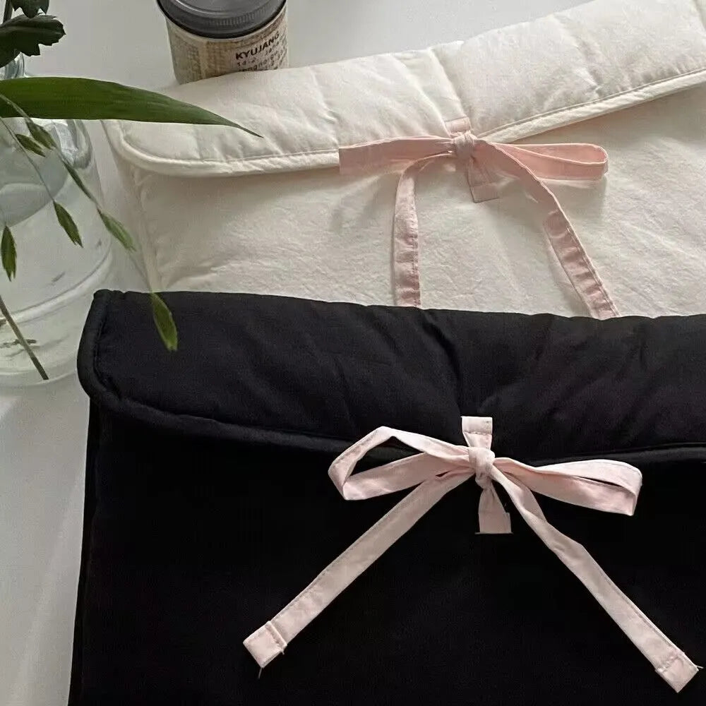 Women's black and white striped quilted laptop bag with ballet bow