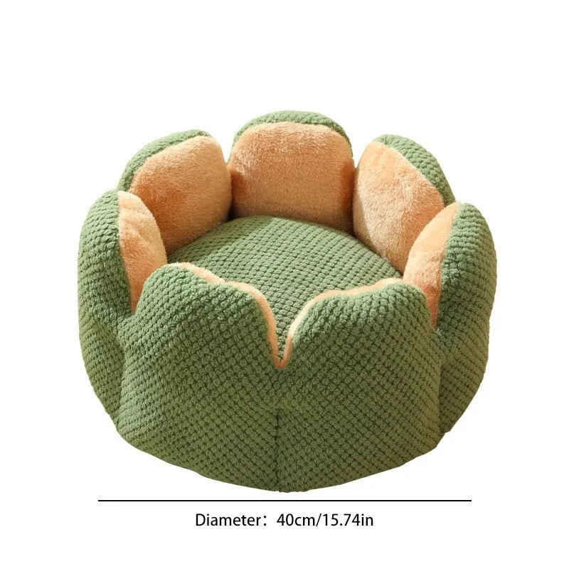 Green cactus petal shaped enclosed plush bed for a cat or small dog on a hardwood floor.