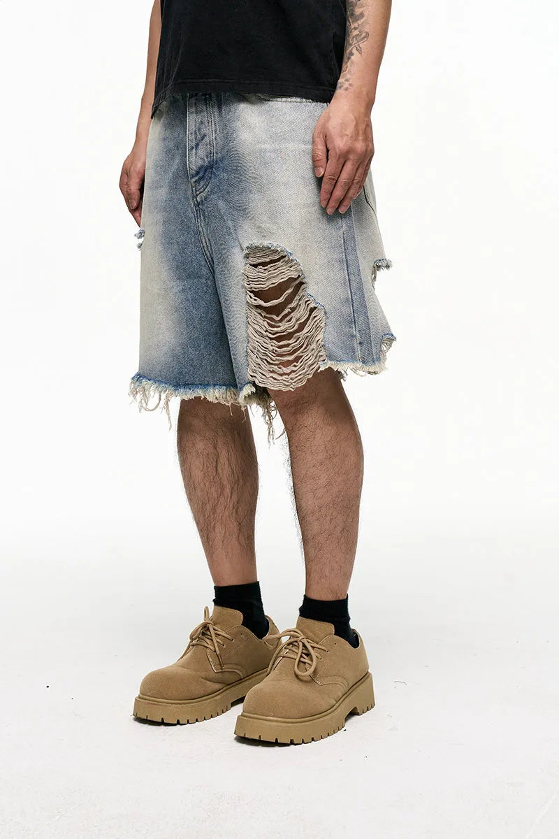 Men's light blue baggy denim shorts with wide legs and retro washed colour.