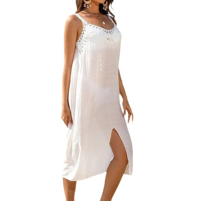 White suspender beach dress with woven crochet detail and a bottom slit.