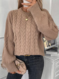Women's beige casual sweater with twist detail and round neckline on hanger