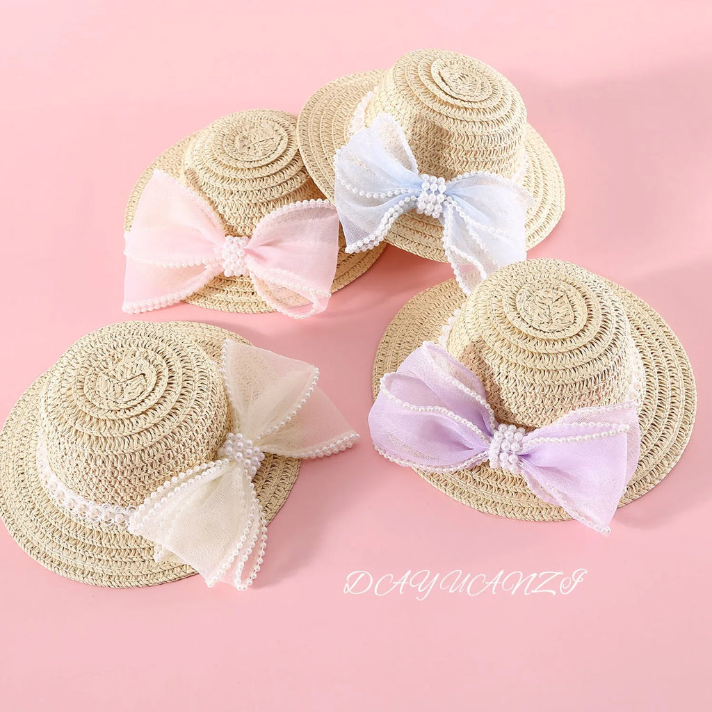 Pet cat wearing woven straw hat with pearl bow decoration in monochrome princess style