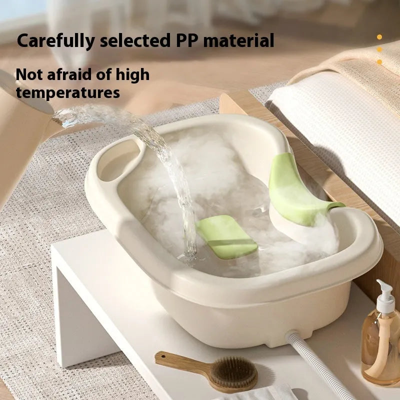 Portable plastic shampoo basin set with neck pillow, water pump, pipe, and brush in light pink and beige.
