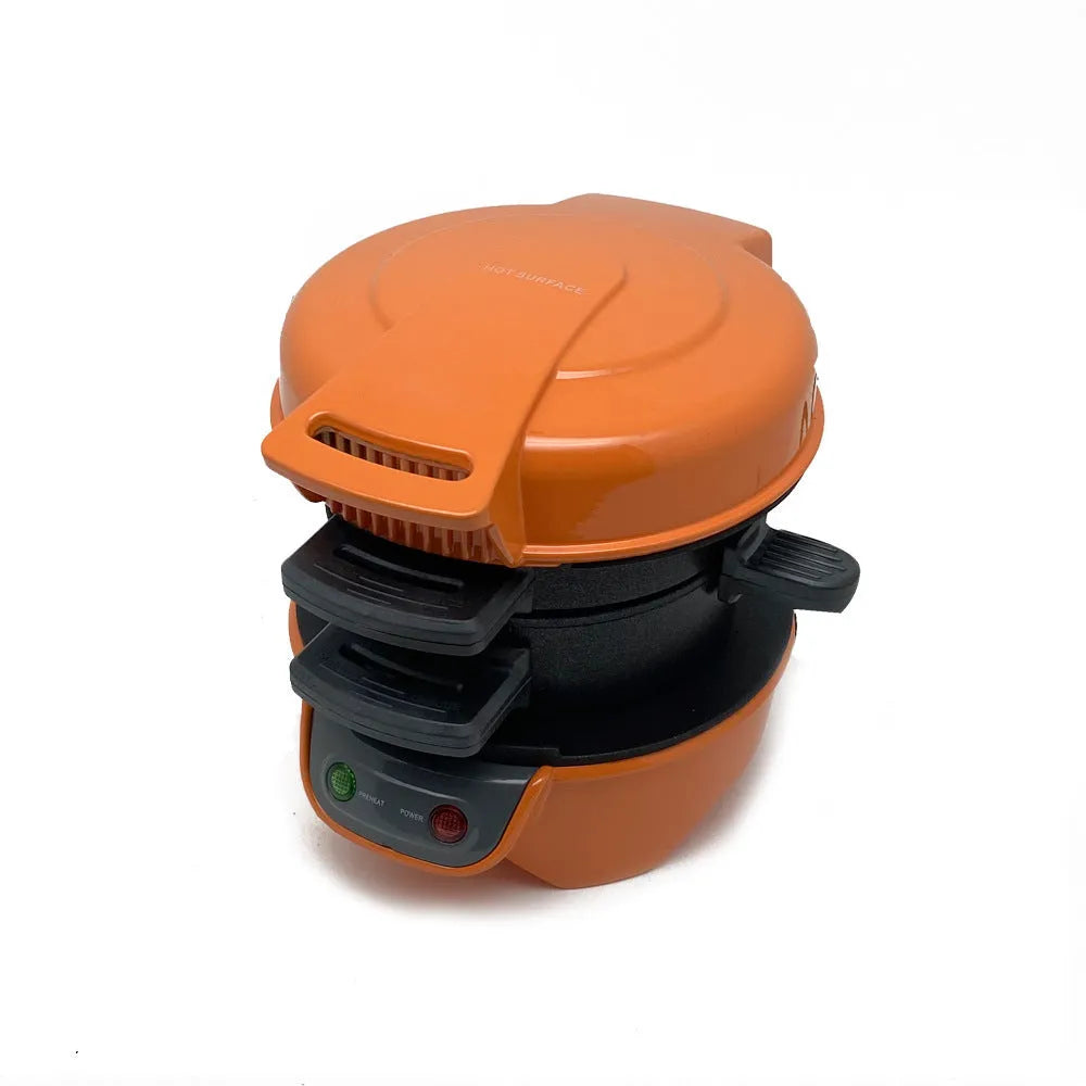 Bright red household breakfast machine with sandwich plates and egg cooking ring on kitchen counter