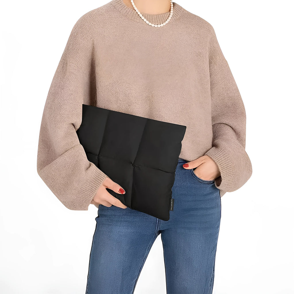 Soft fluffy polyester laptop sleeve in black or khaki for 13 to 15.6 inch laptops.