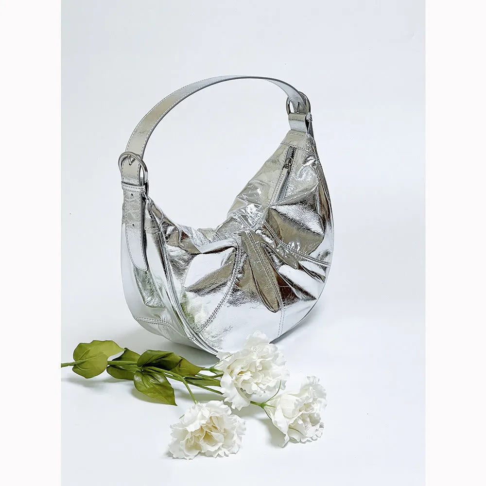 Women's soft cowhide leather dumpling-shaped shoulder bag in silver colour with double straps.