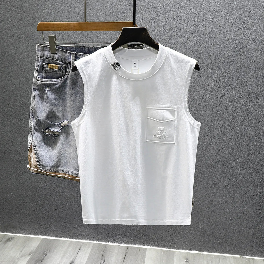 Man wearing a loose-fit black cotton sleeveless t-shirt or muscle tank.