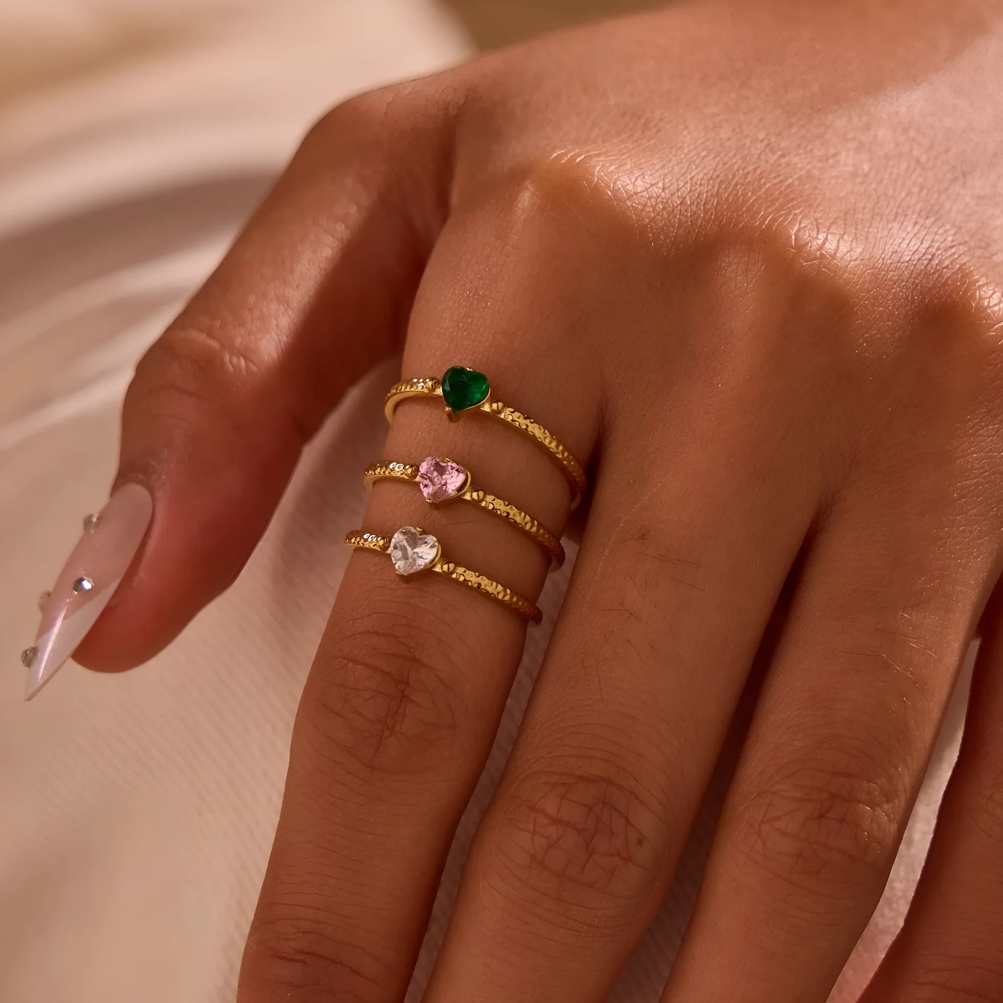 Adjustable open-ended stainless steel ring with heart-shaped zircon design in three colour options