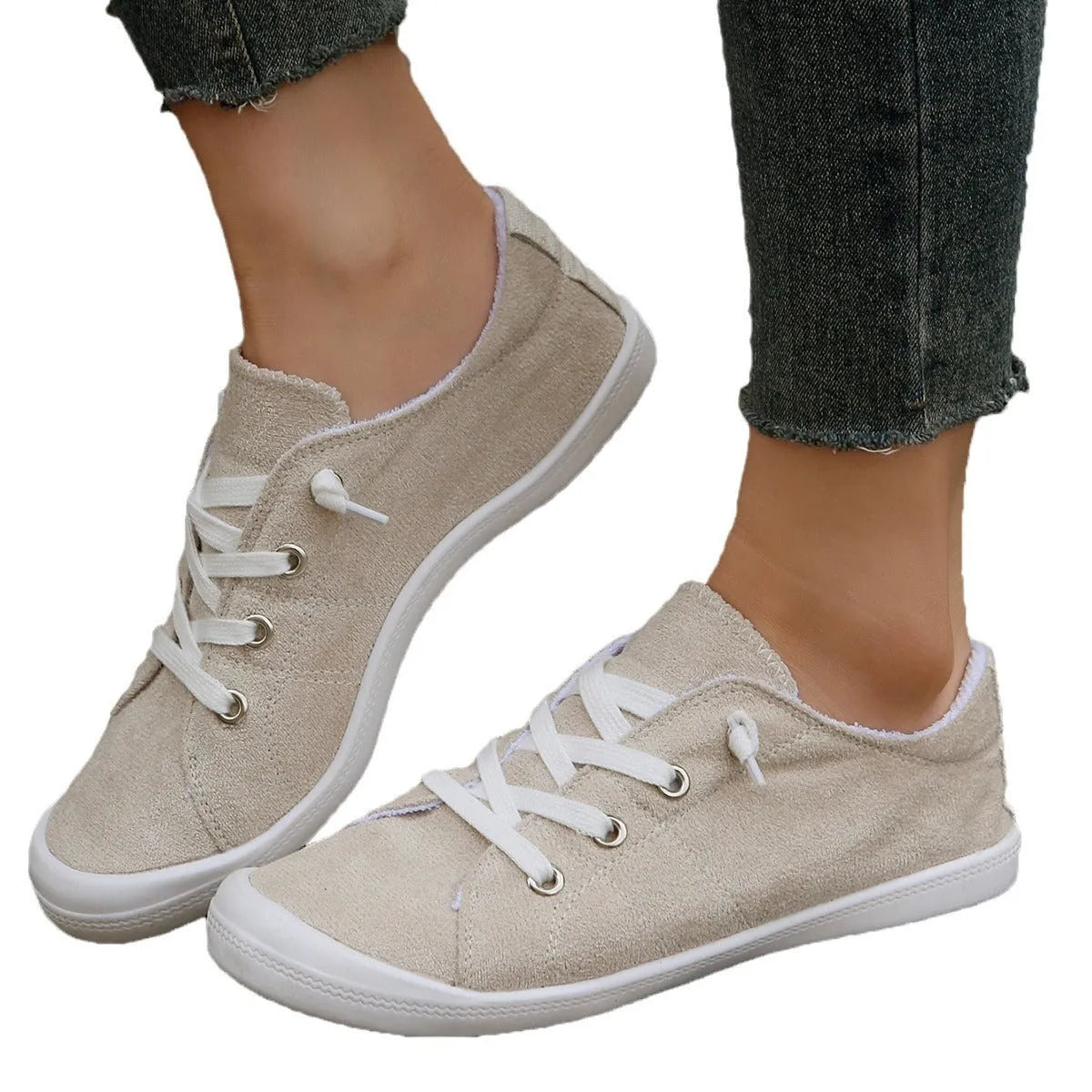Women's creamy-white fabric casual sneakers with low-top design and rubber soles