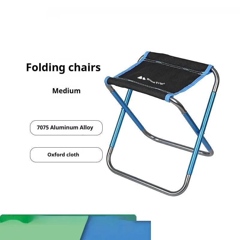 Black aluminium alloy folding stool shown in a folded position for portable storage.