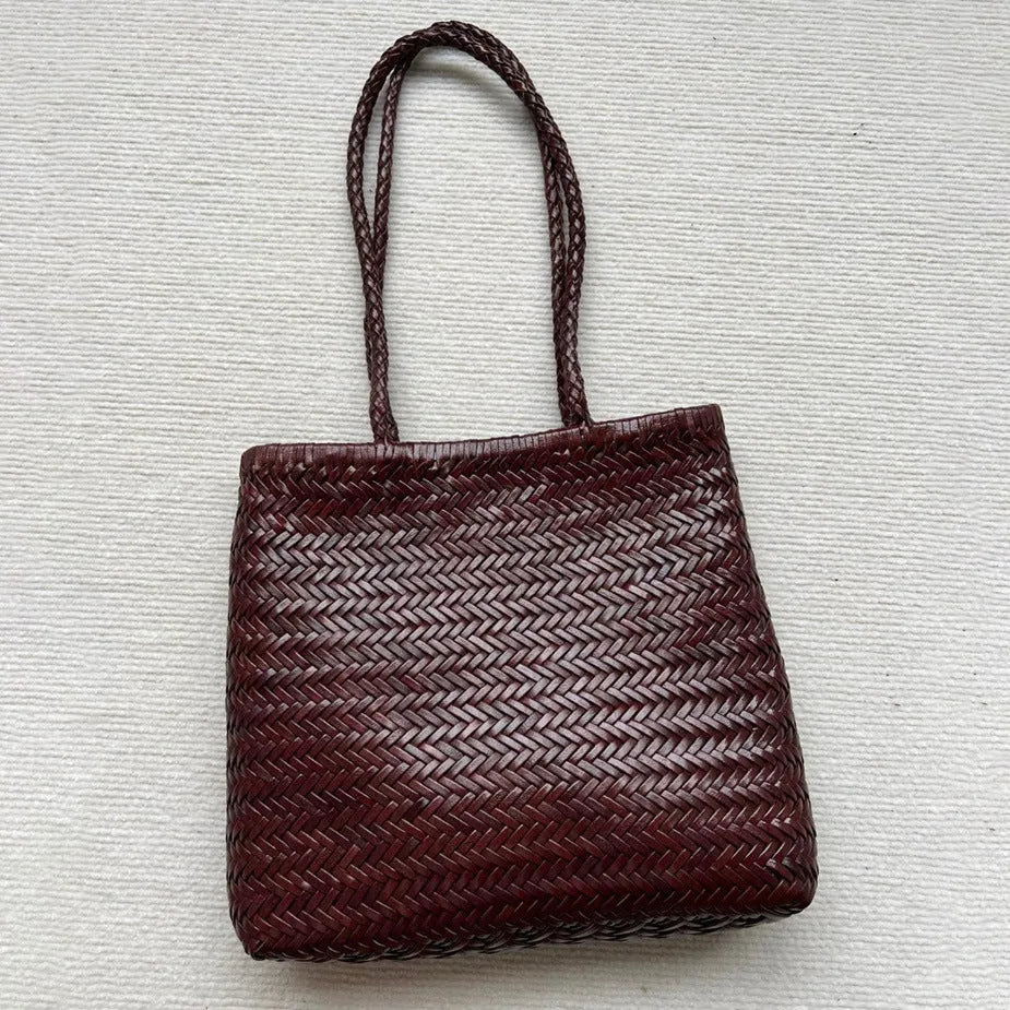 Brown woven leather tote bag with three-dimensional pockets measuring 27cm high by 30cm wide