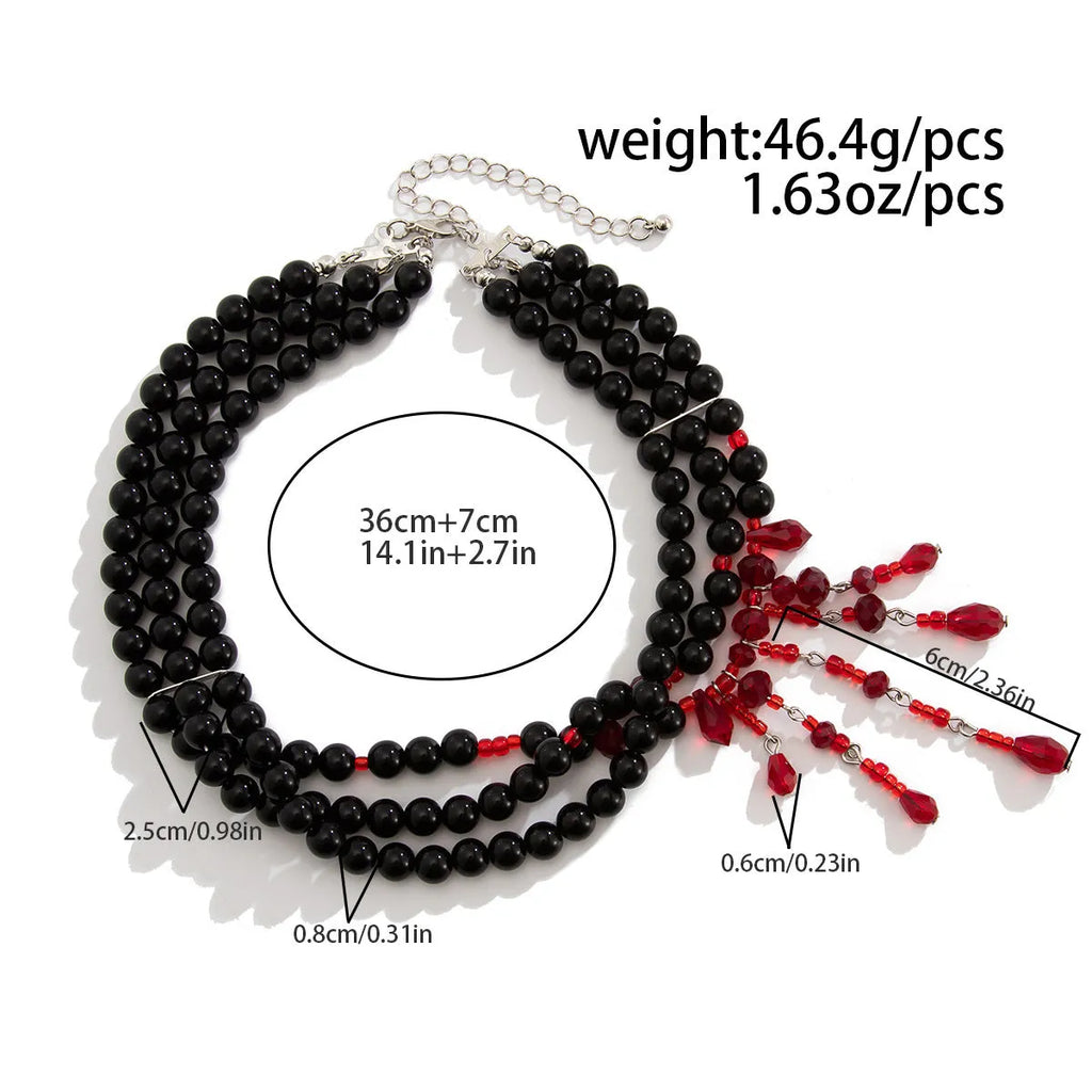 Men's Halloween necklace with geometric blood drop pendant, artificial crystal details, and imitation pearl chain.