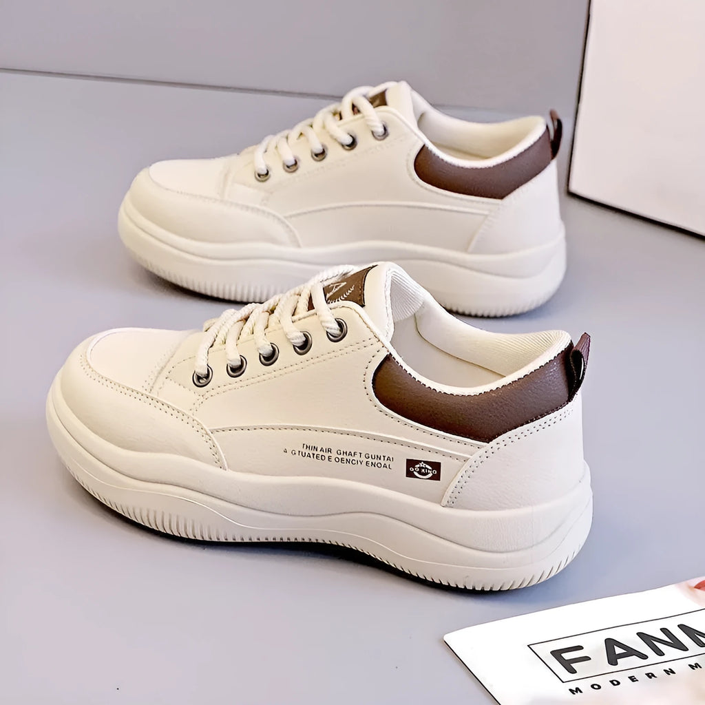 Women's white Korean-style lace-up pumps with cross straps and round toe, showing leather stitching details
