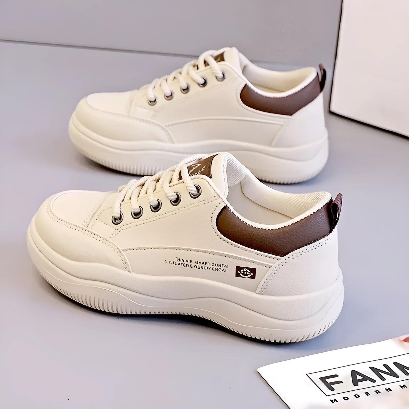 Women's white Korean-style lace-up pumps with cross straps and round toe, showing leather stitching details