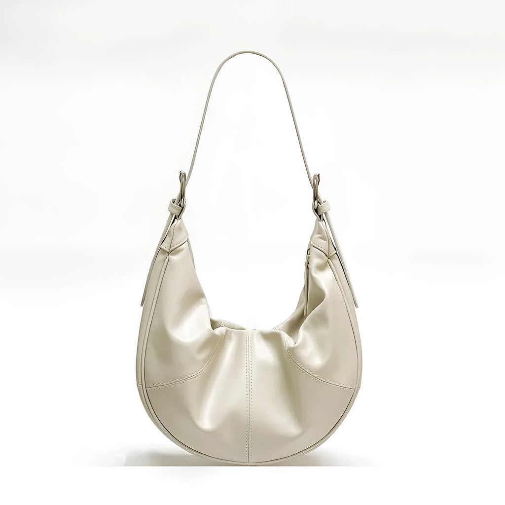 Women's soft cowhide leather dumpling-shaped shoulder bag in silver colour with double straps.