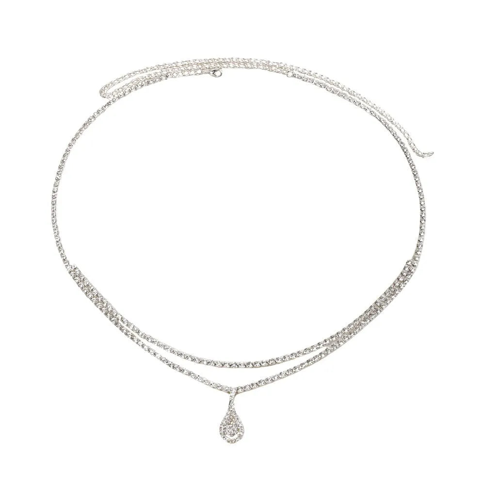 Gold and silver waist chain with a water drop pendant and rhinestone details on a model.