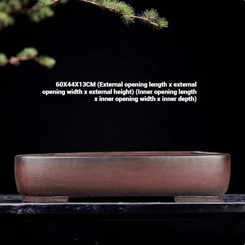 Handmade antique rectangular purple clay flower pot showing traditional ceramic texture