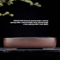 Handmade antique rectangular purple clay flower pot showing traditional ceramic texture