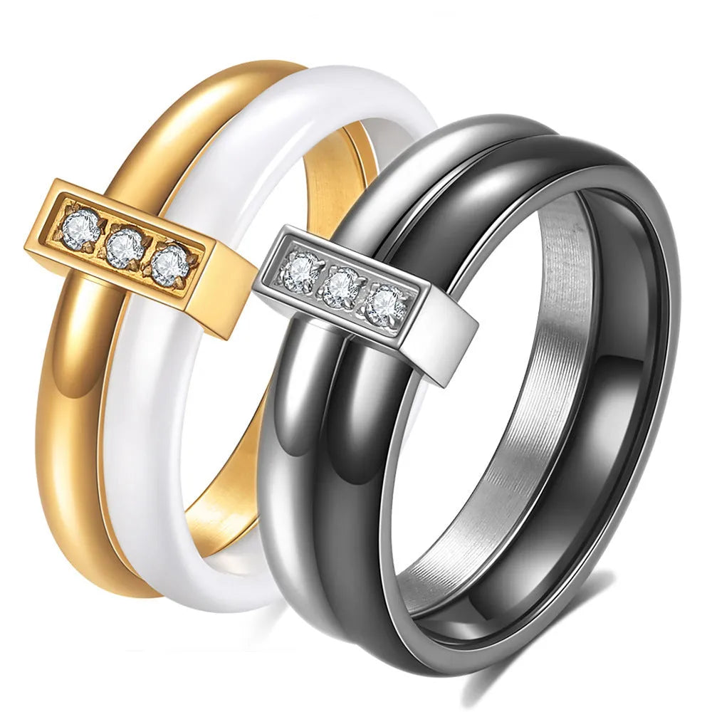 Ceramic women's ring with 6mm band width and inlaid zirconium accents in geometric round design