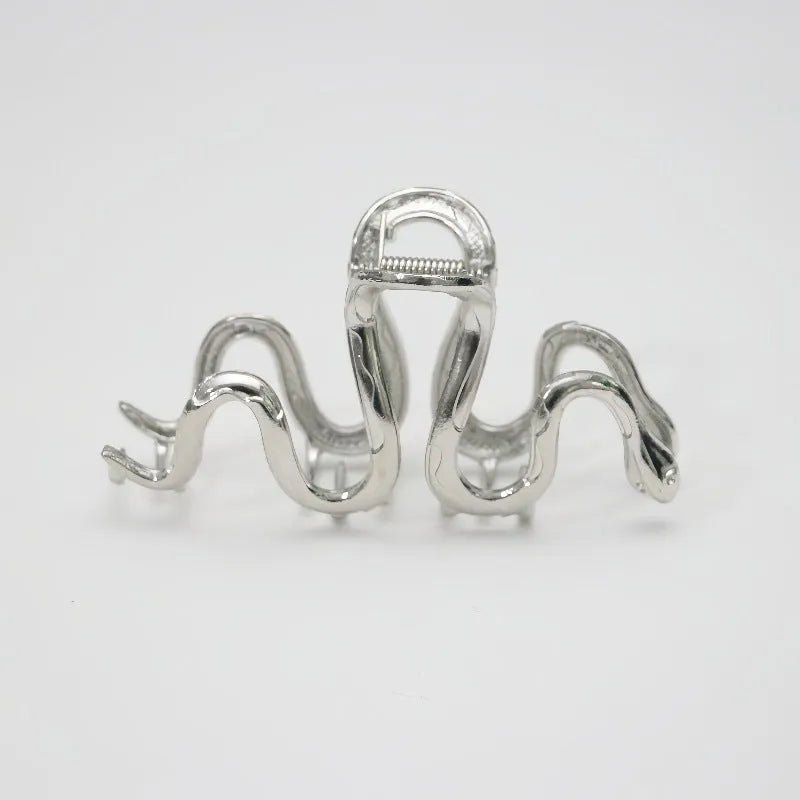 Silver metal hair barrette with a detailed Slytherin snake design, measuring 10.5 cm in length.