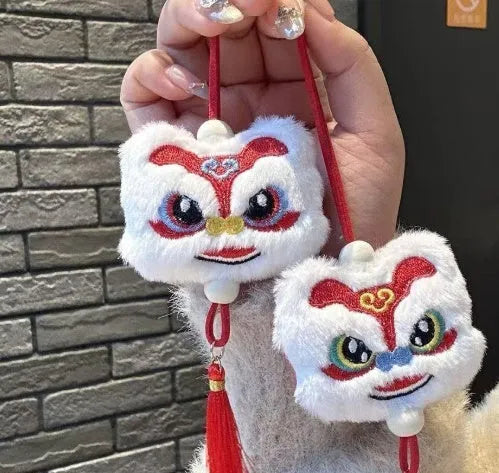 Handmade blue and yellow Chinese style plush lion keychain ornament with tassel and star stone.