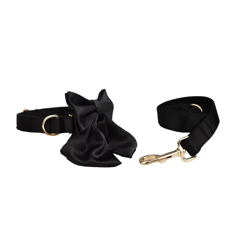 Complete dog accessory set with collar, leash, bow, and vest in cloth material