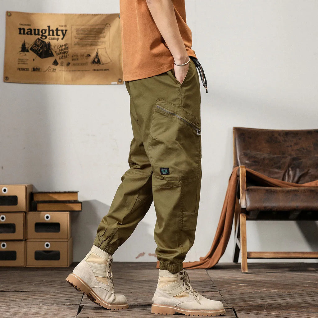 Men's loose fit khaki harem pants with ankle band and zip fly, made from non-ironing cotton fabric.