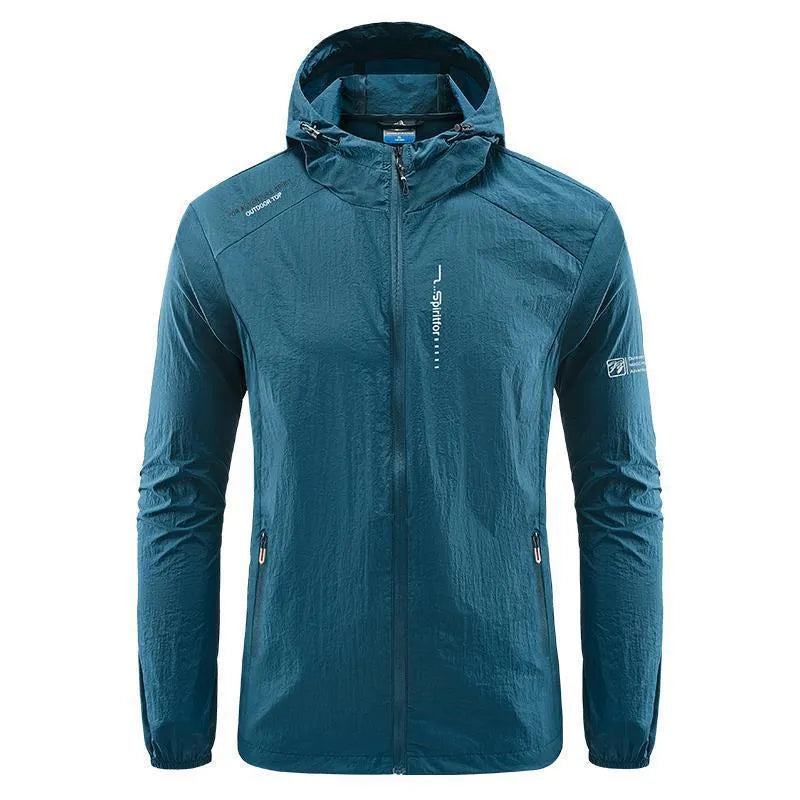 Man wearing a lightweight grey hooded summer jacket made from thin nylon fabric.