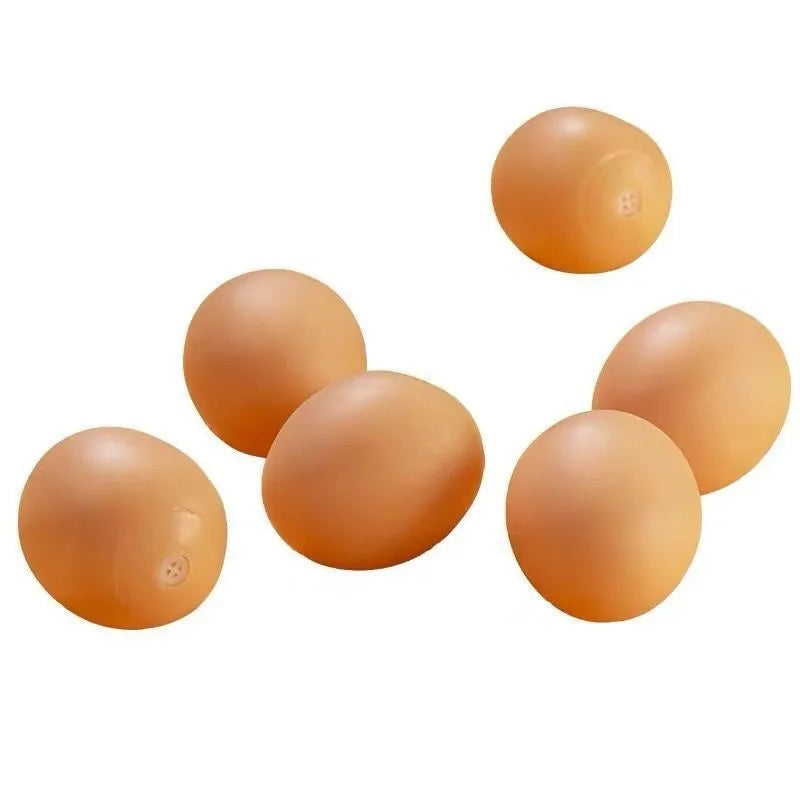 Egg-shaped dog chew toy with textured surfaces for dental cleaning and sound feature