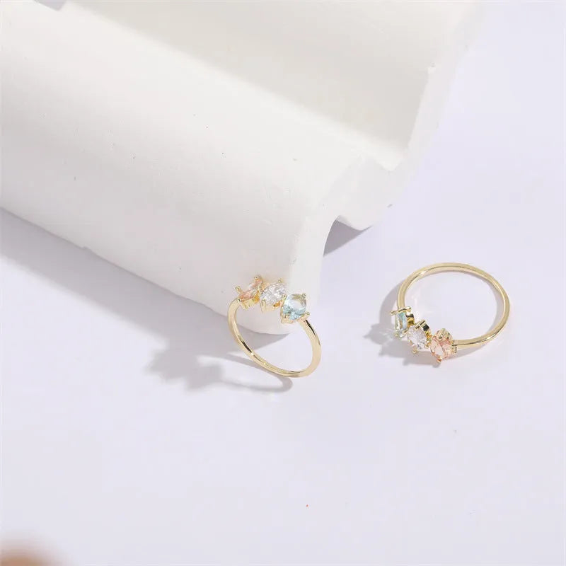 Women's Mother's Day birthstone ring with geometric triangle design and horse eye tricolor zircon stones