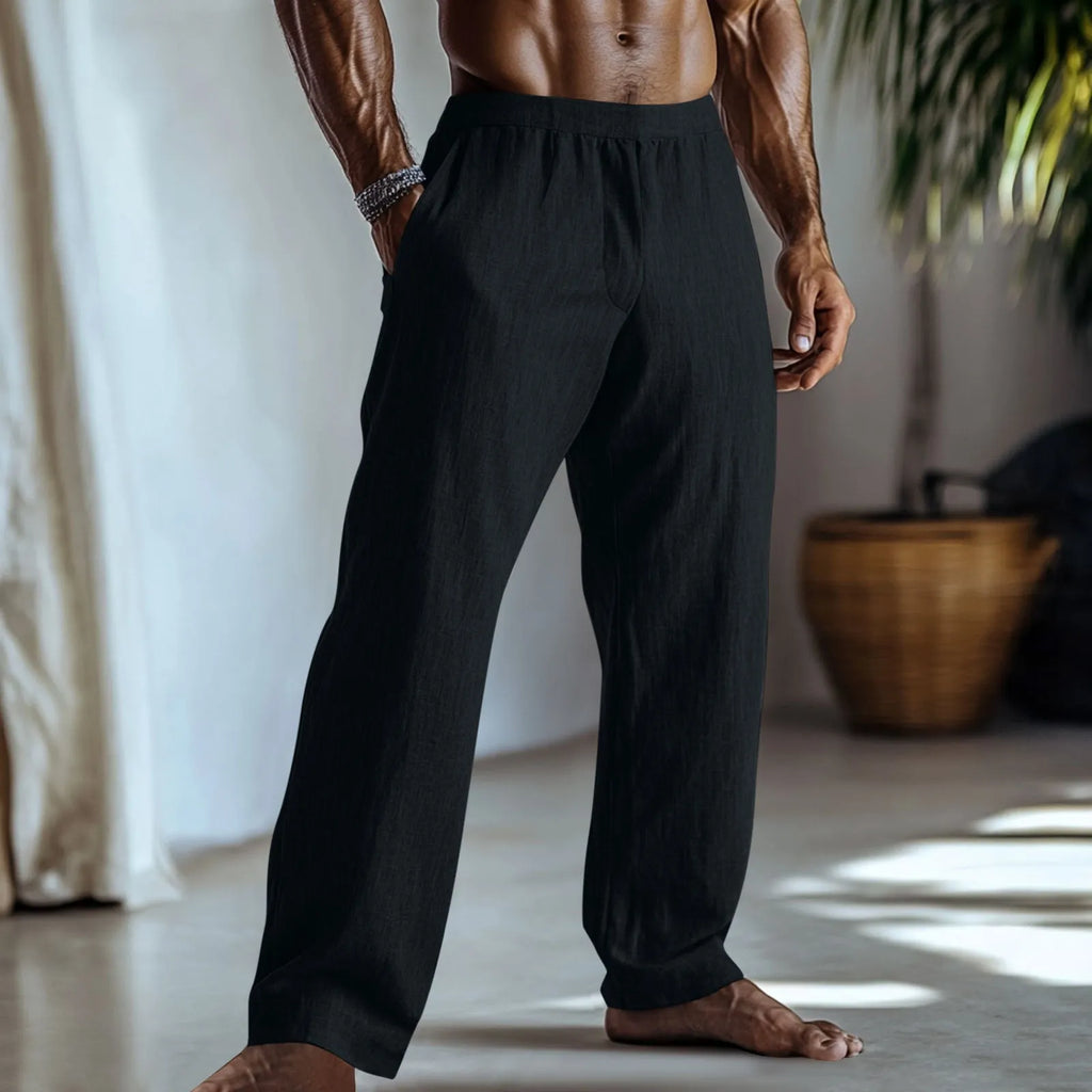 Straight leg casual trousers in cotton and linen fabric in a light green colour, shown with side pockets.