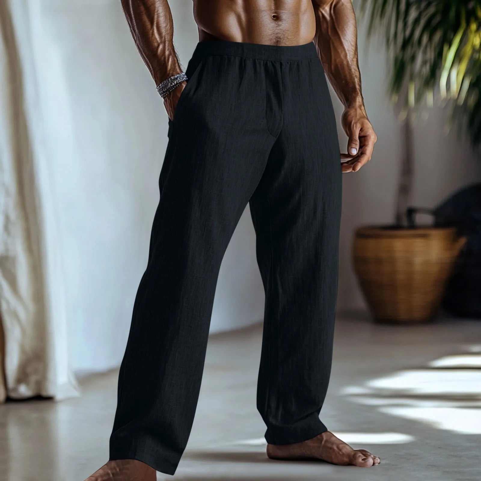 Straight leg casual trousers in cotton and linen fabric in a light green colour, shown with side pockets.