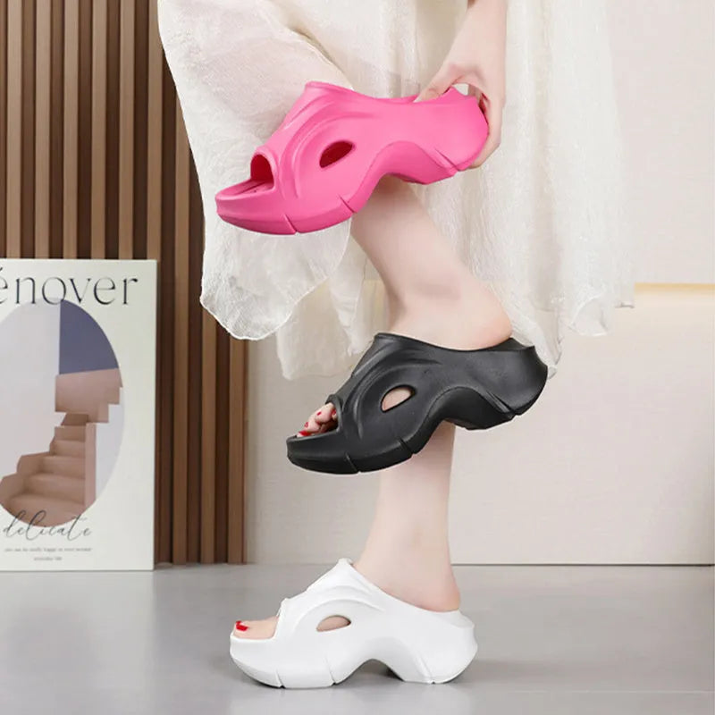 Women's white EVA slippers with thick sole and round toe on sandy beach