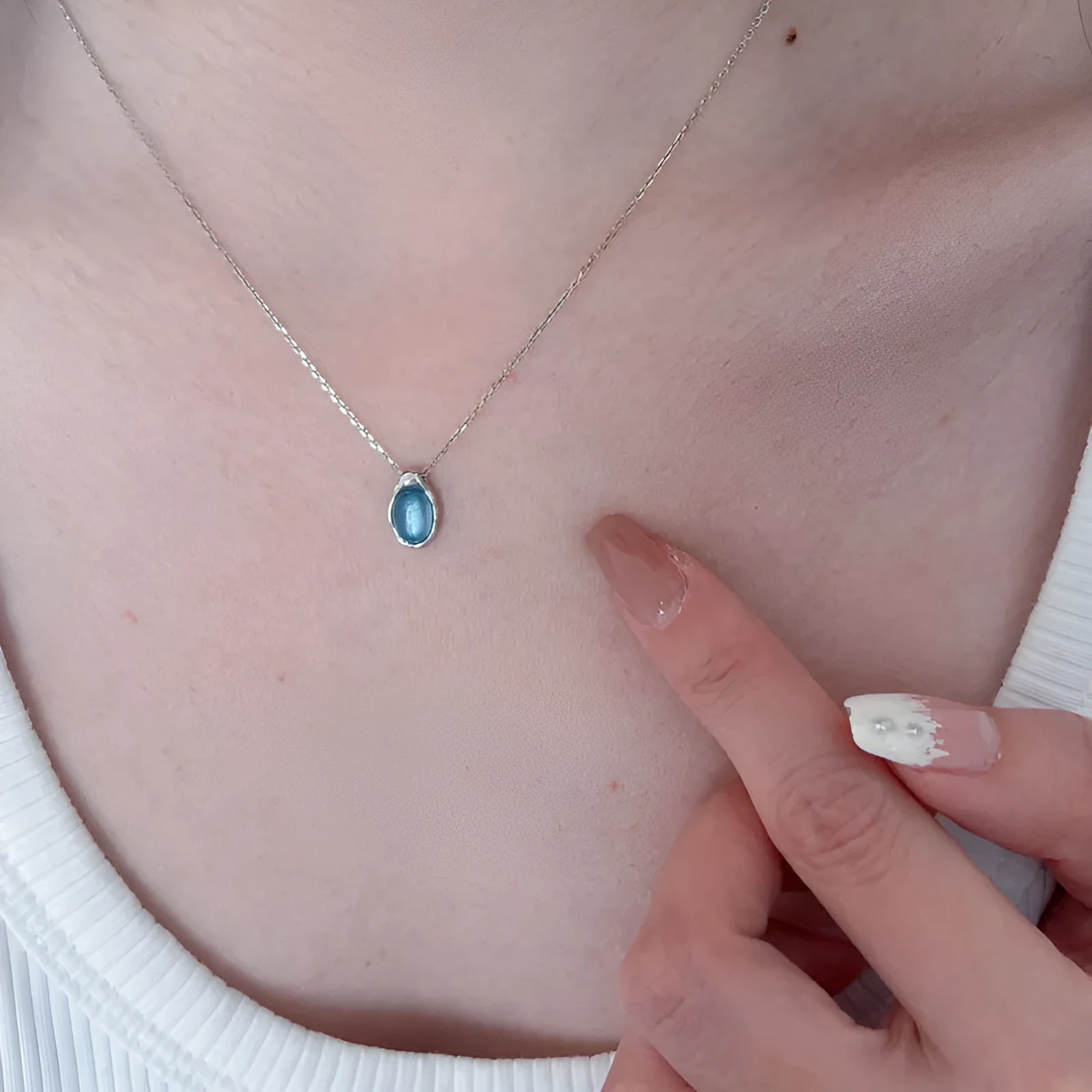 Navy blue geometric water drop necklace with adjustable chain and cross chain design