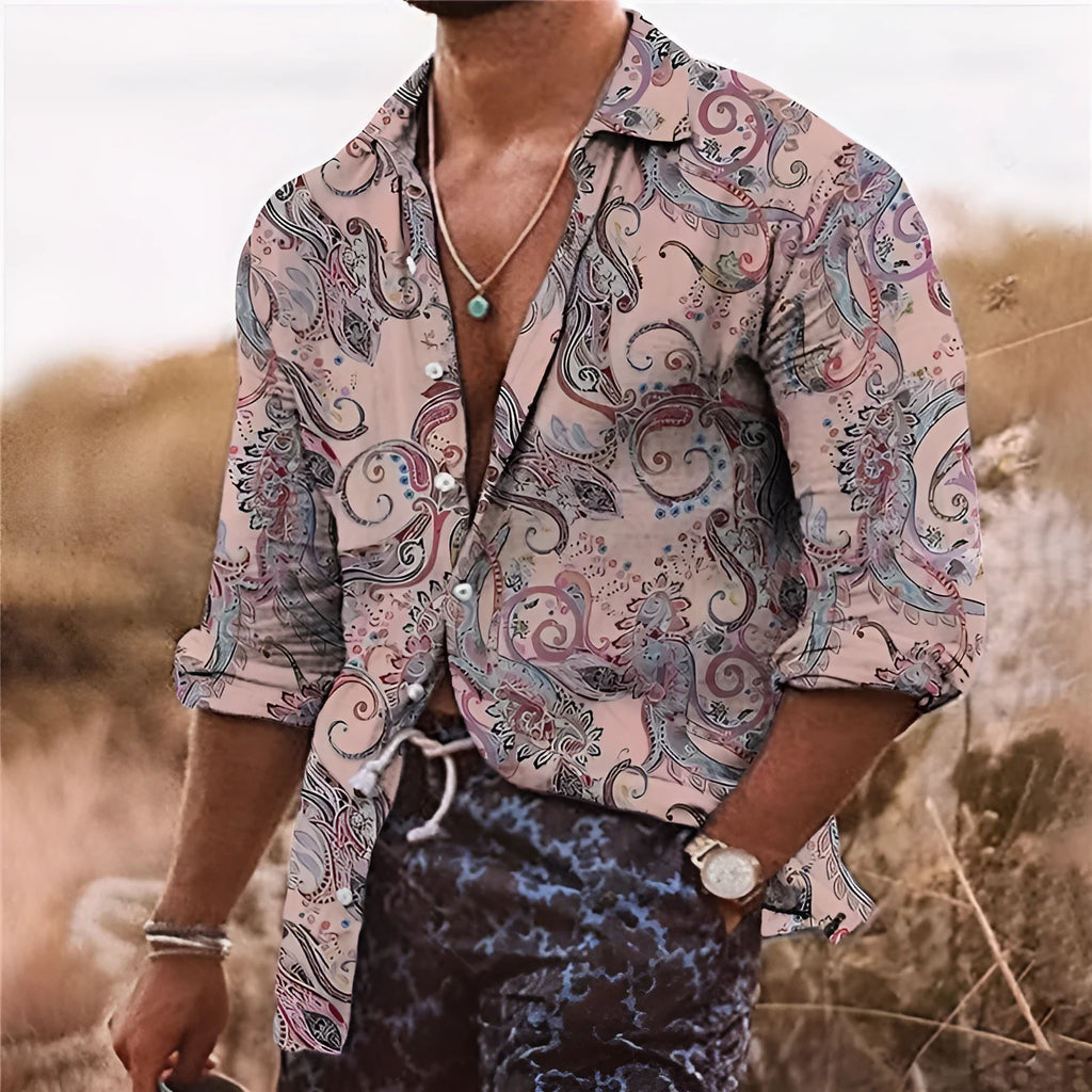 Man wearing a loose fit long sleeve shirt with a colourful 3D digital printed floral bohemian pattern.