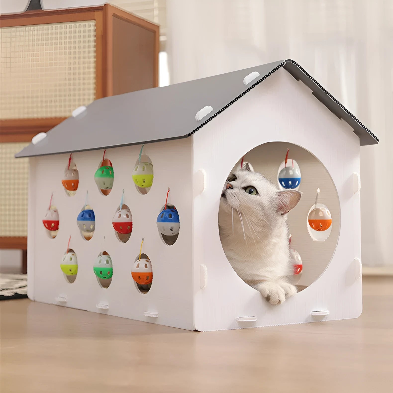 House-shaped cat scratch board with integrated bell ball and tunnel for indoor cats