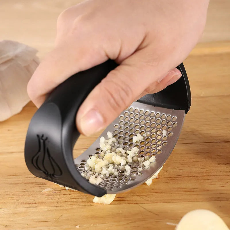 304 stainless steel garlic press in a choice of black, blue, green, or pink colours.