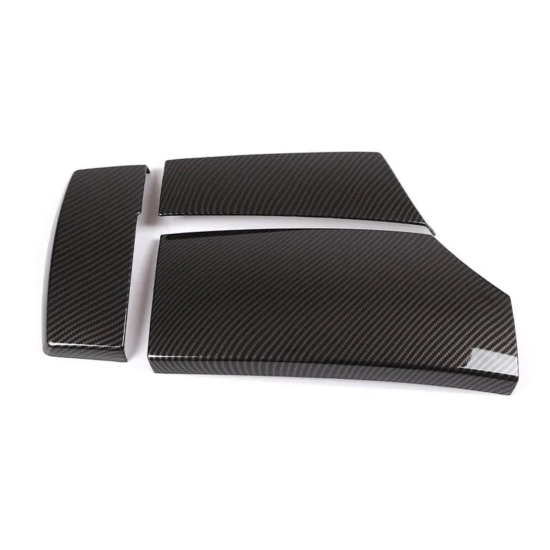 Three black ABS car armrest box covers with a glossy carbon fibre weave pattern.