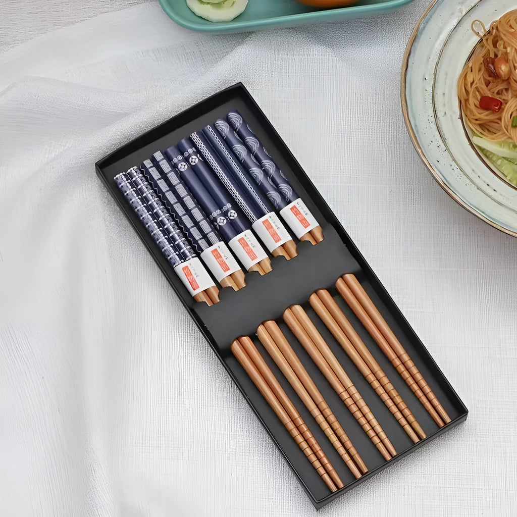 Set of five pairs of bamboo chopsticks with Japanese lucky cat pattern in a gift box.