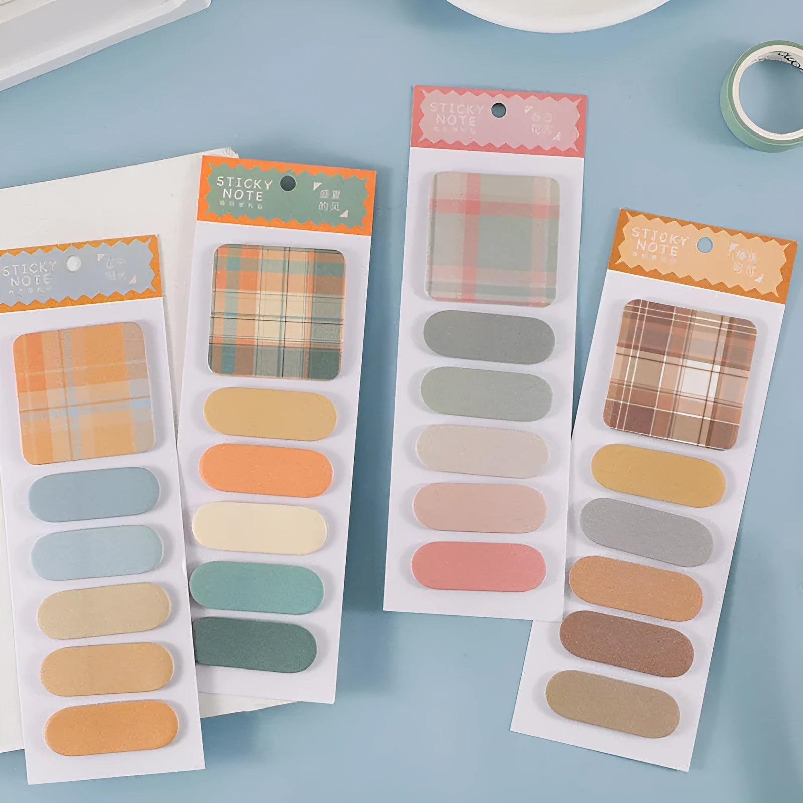 Colourful memo pad sticky notes set showing six different plaid and solid colour designs