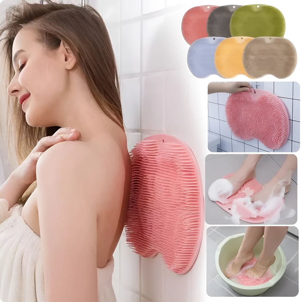Orange silicone bristle bath brush with suction cup base on a bathroom floor
