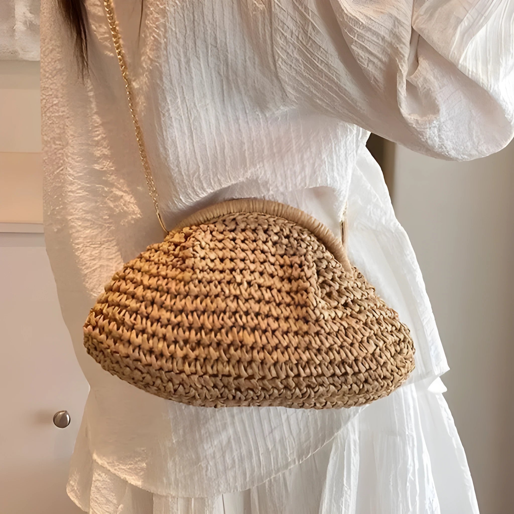 Women's shell-shaped straw shoulder bag with chain strap in khaki colour showing zippered internal pocket