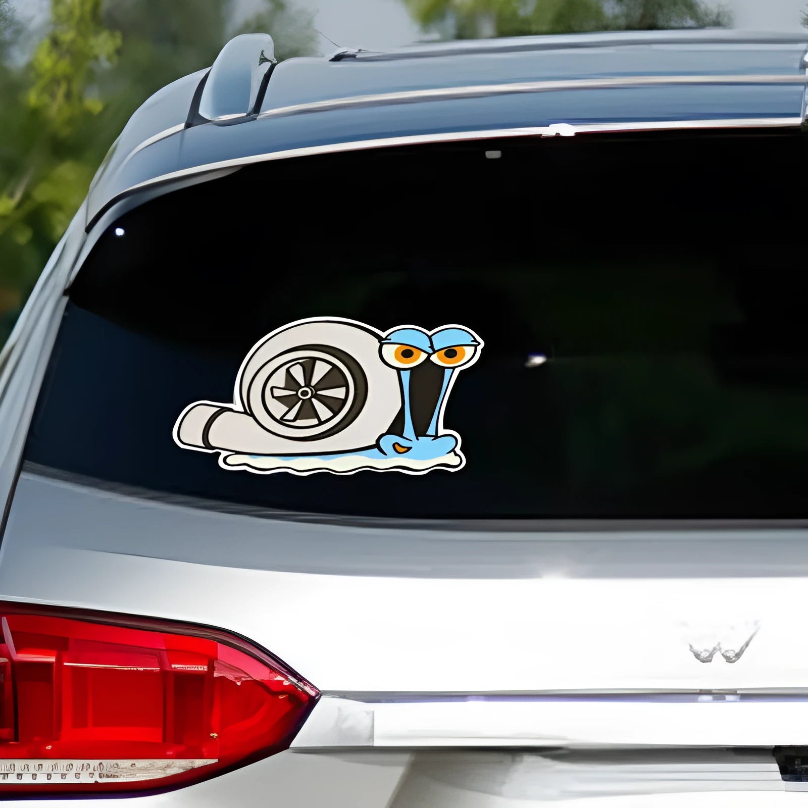 White reflective cartoon pattern car sticker measuring 12 by 8 centimetres.