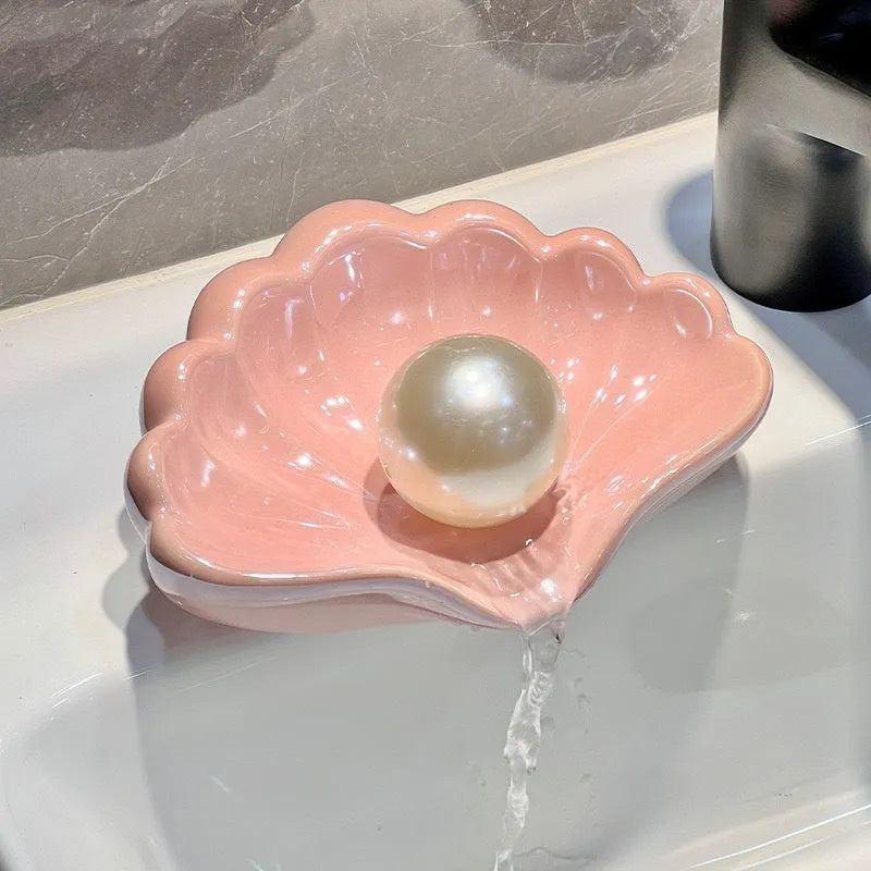 Plastic shell-shaped soap dish in pearl white or pink for bathroom use